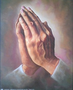 manos en oración