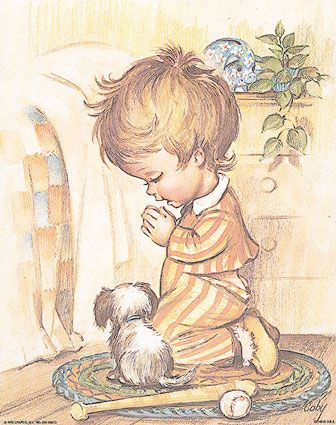 Niño rezando con su perro